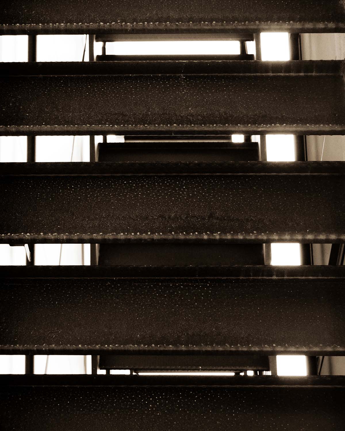 under concrete stairs